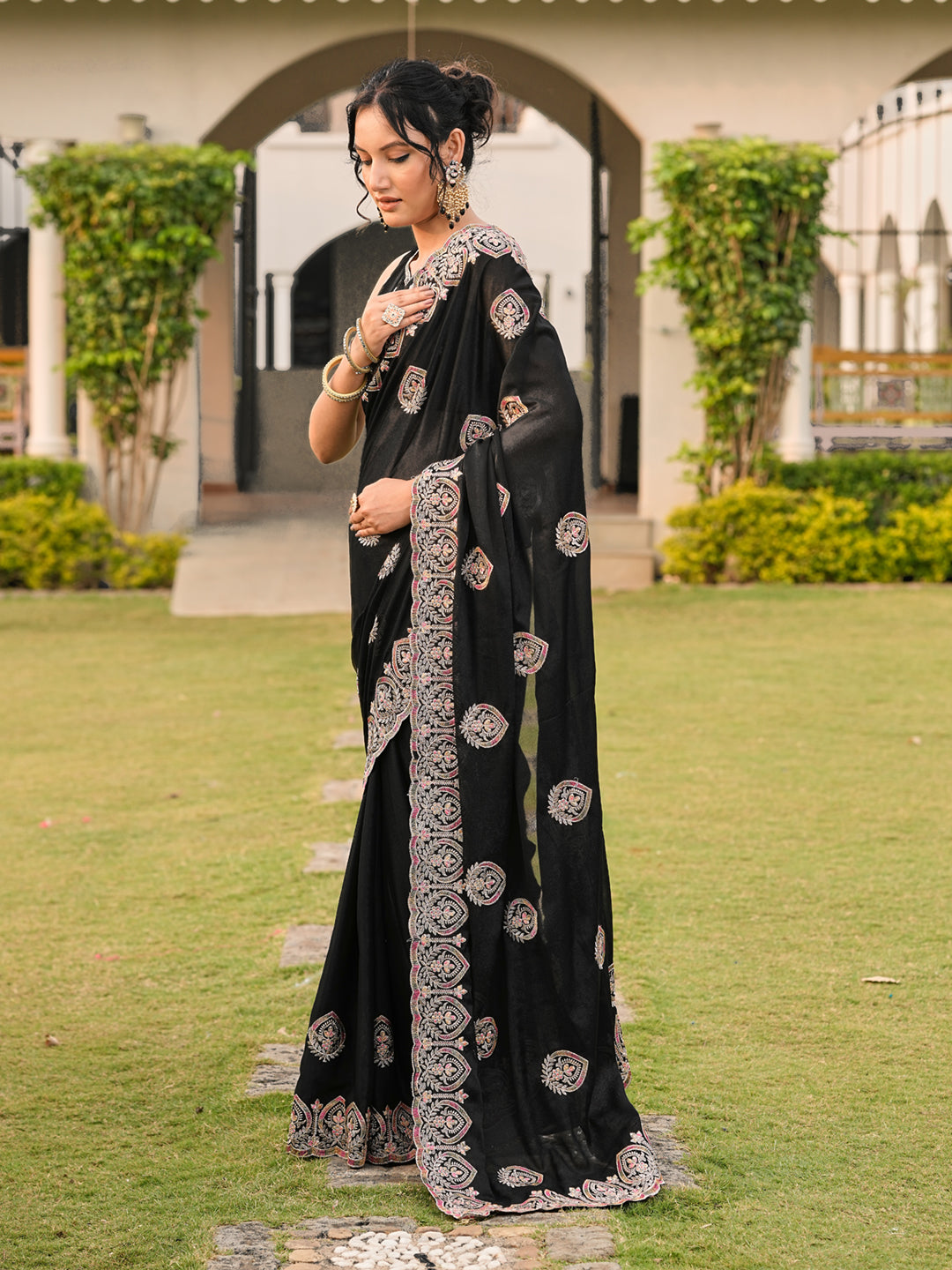 Black colored shimmer georgette base embroidered saree
