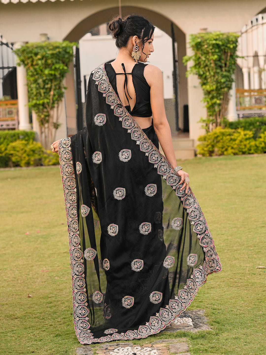 Black colored shimmer georgette base embroidered saree