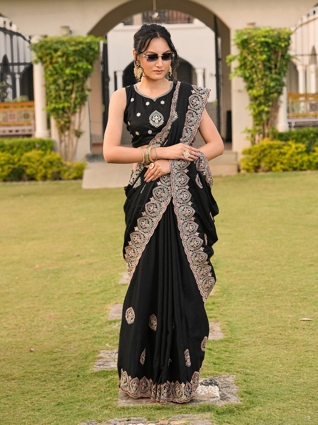 Black colored shimmer georgette base embroidered saree