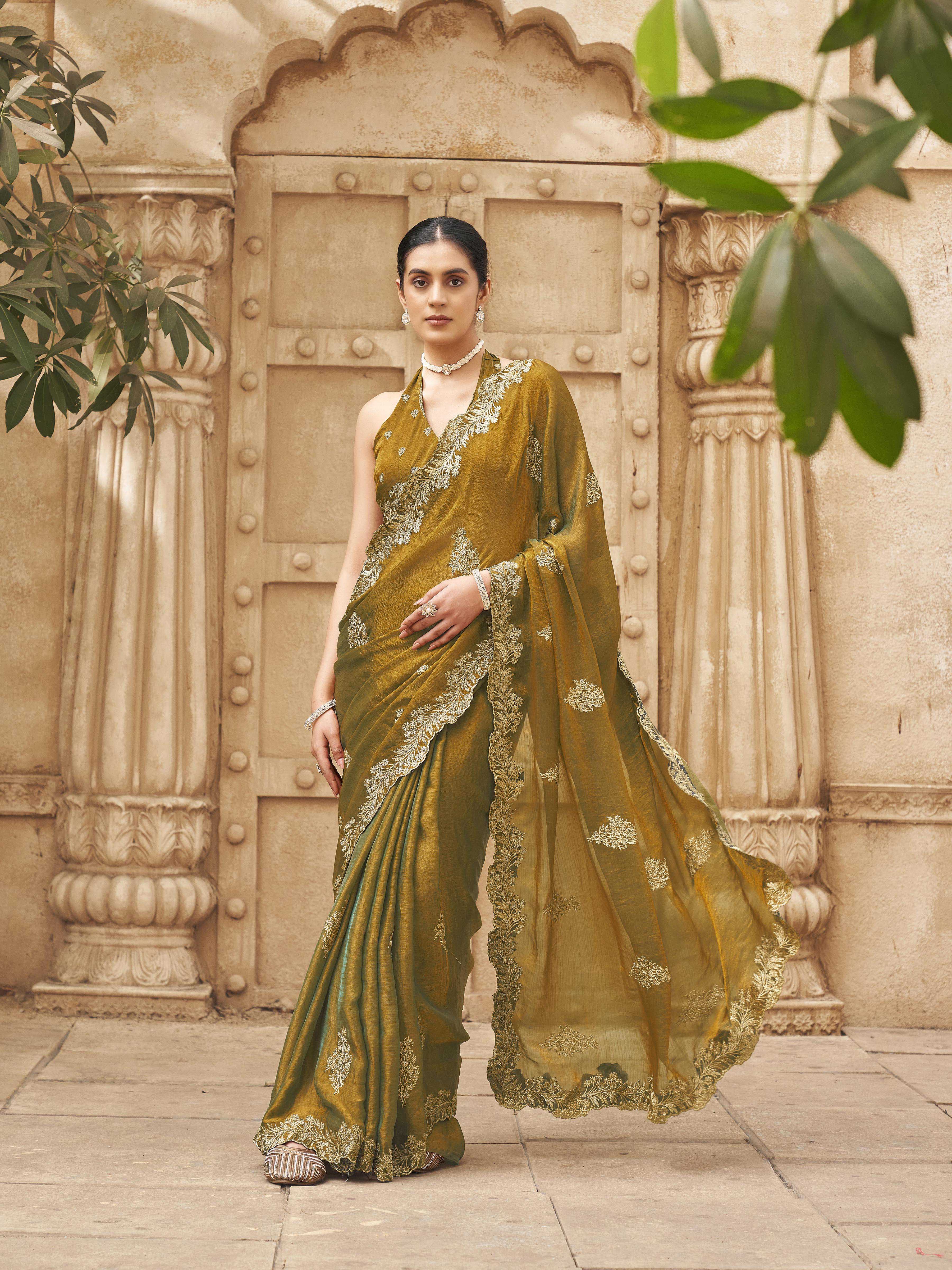 Two tone green and gold colored embroidered saree