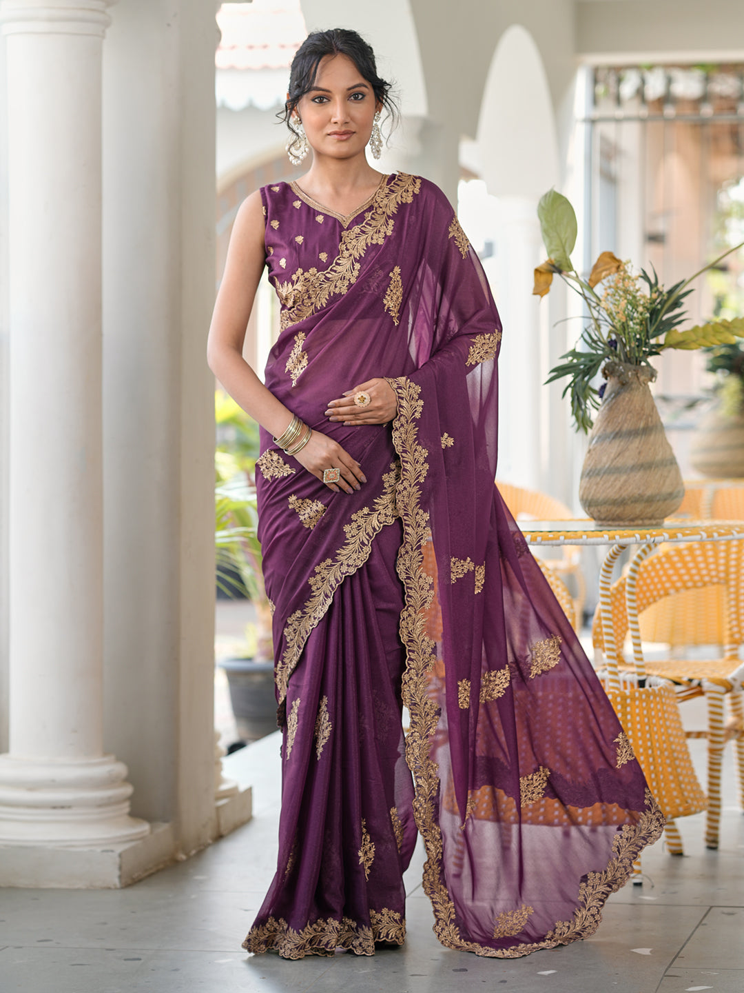 Magenta colored shimmer georgette based jari embroidered saree