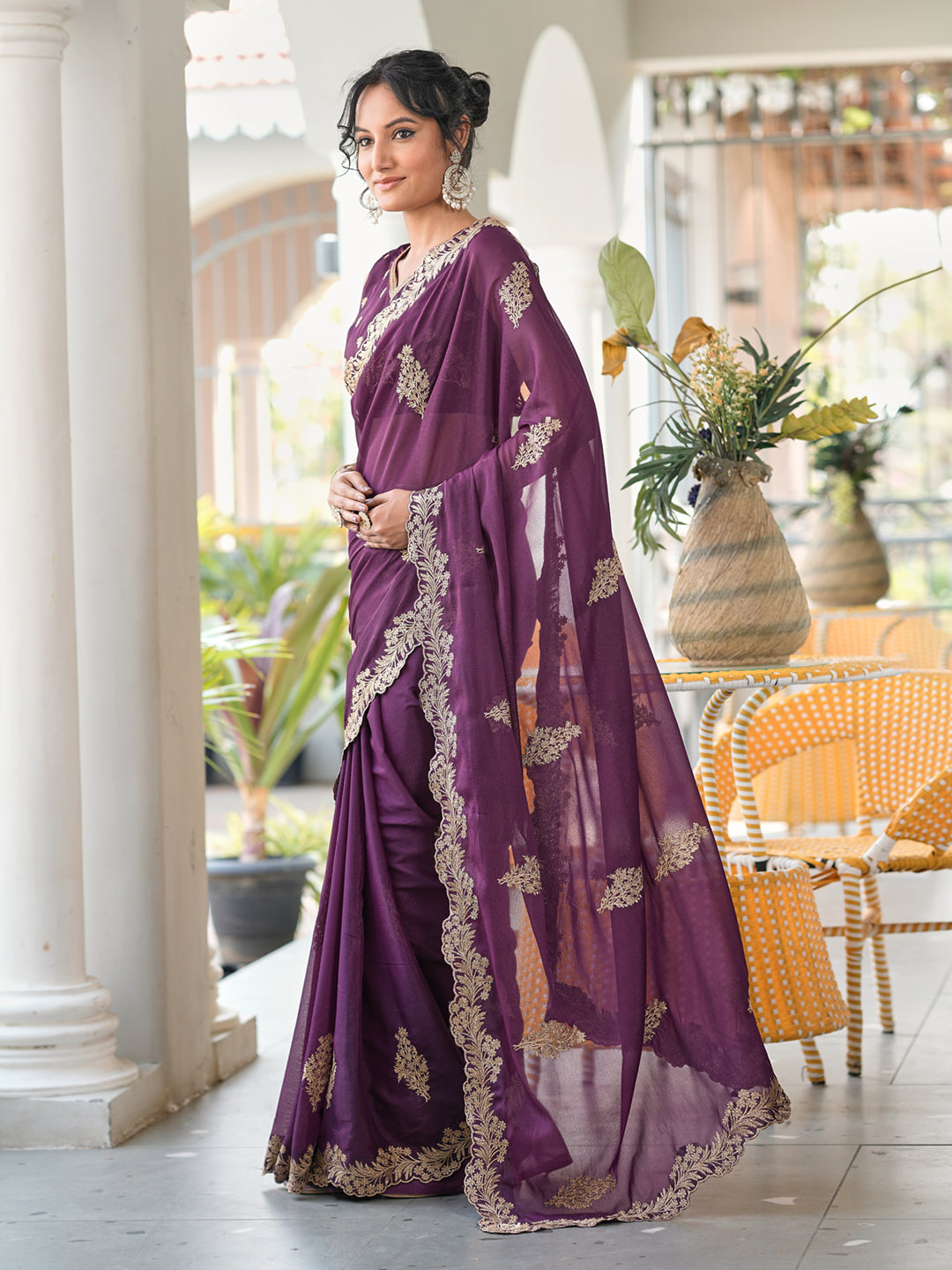 Magenta colored shimmer georgette based jari embroidered saree