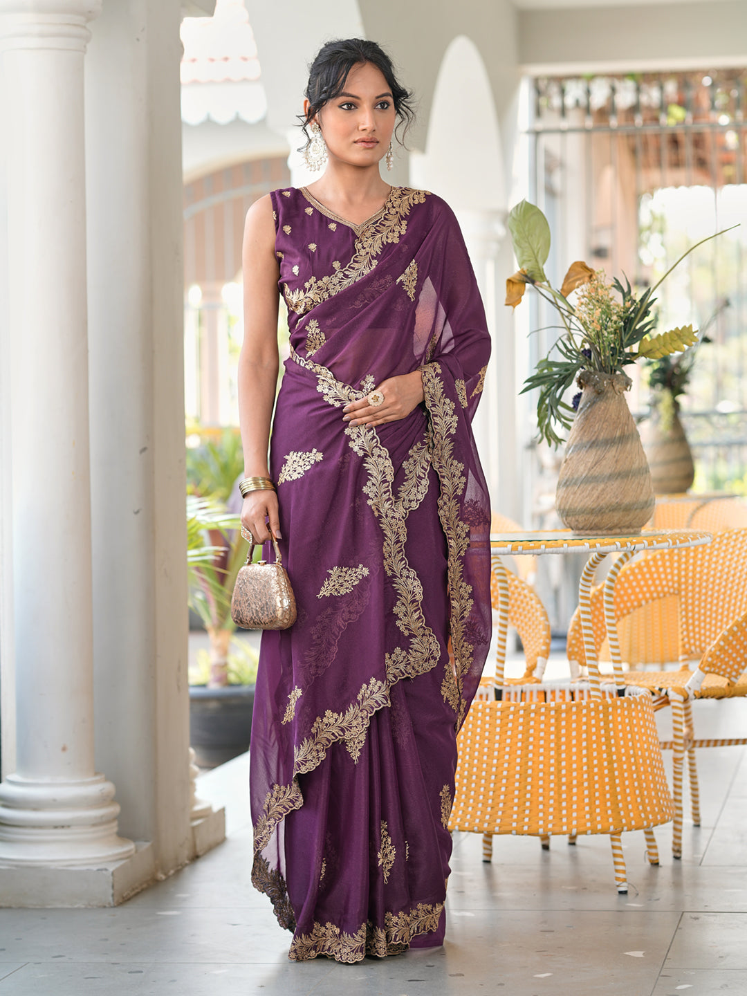 Magenta colored shimmer georgette based jari embroidered saree