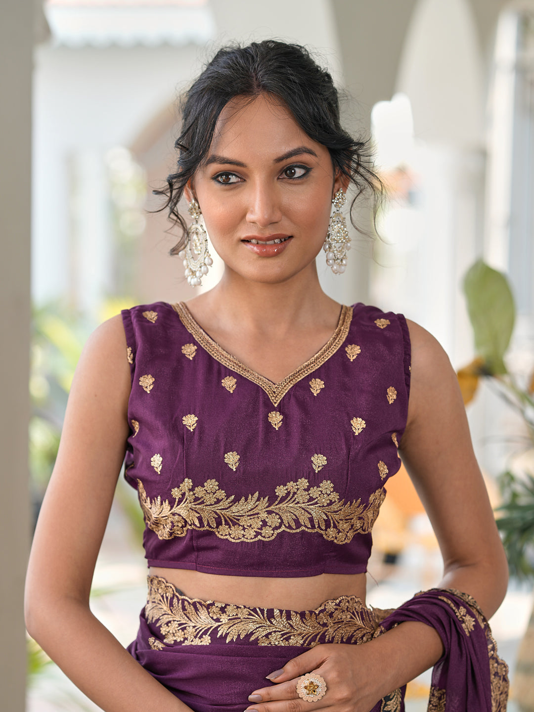 Magenta colored shimmer georgette based jari embroidered saree