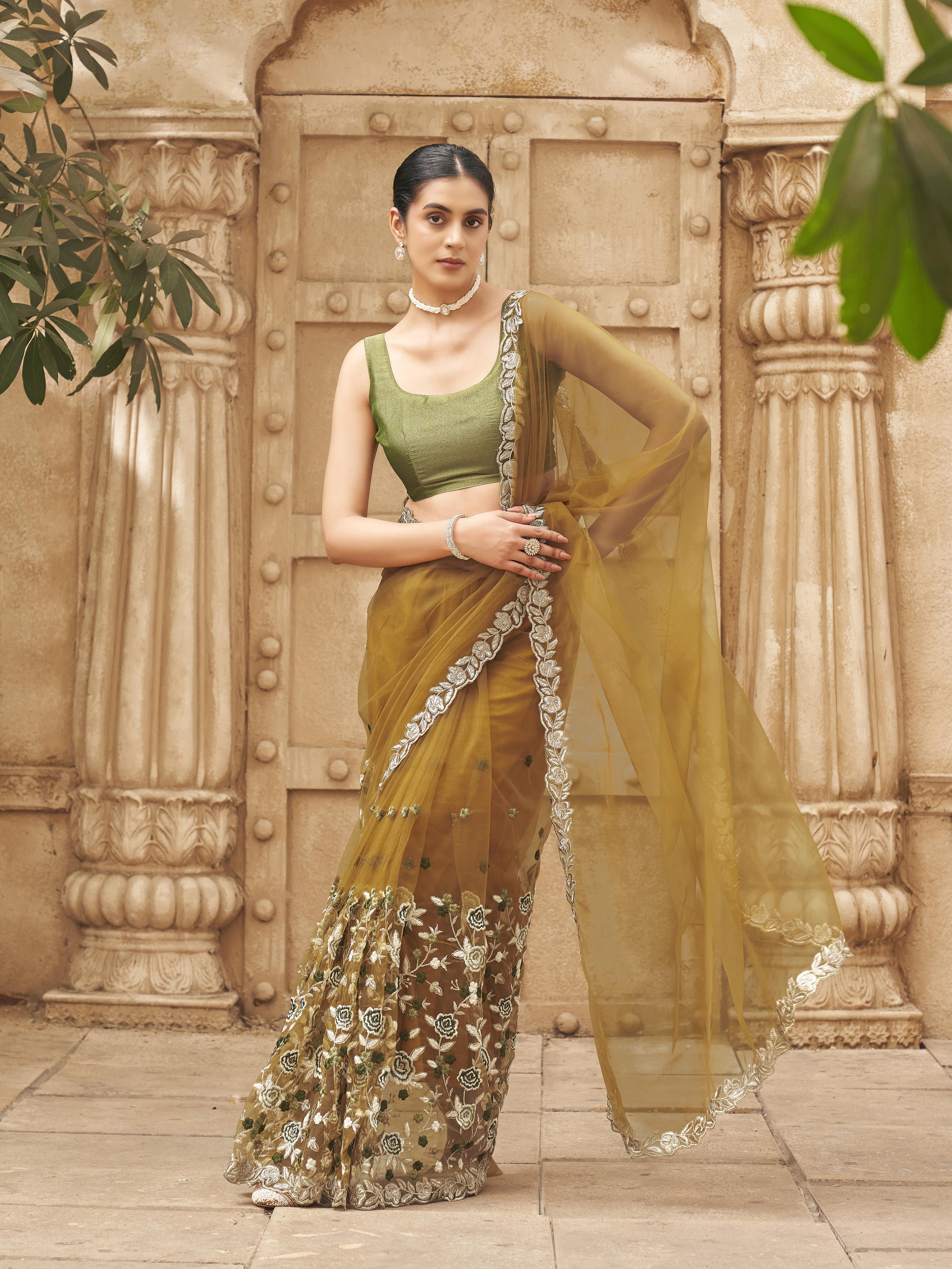 Mustard colored embroidered net saree