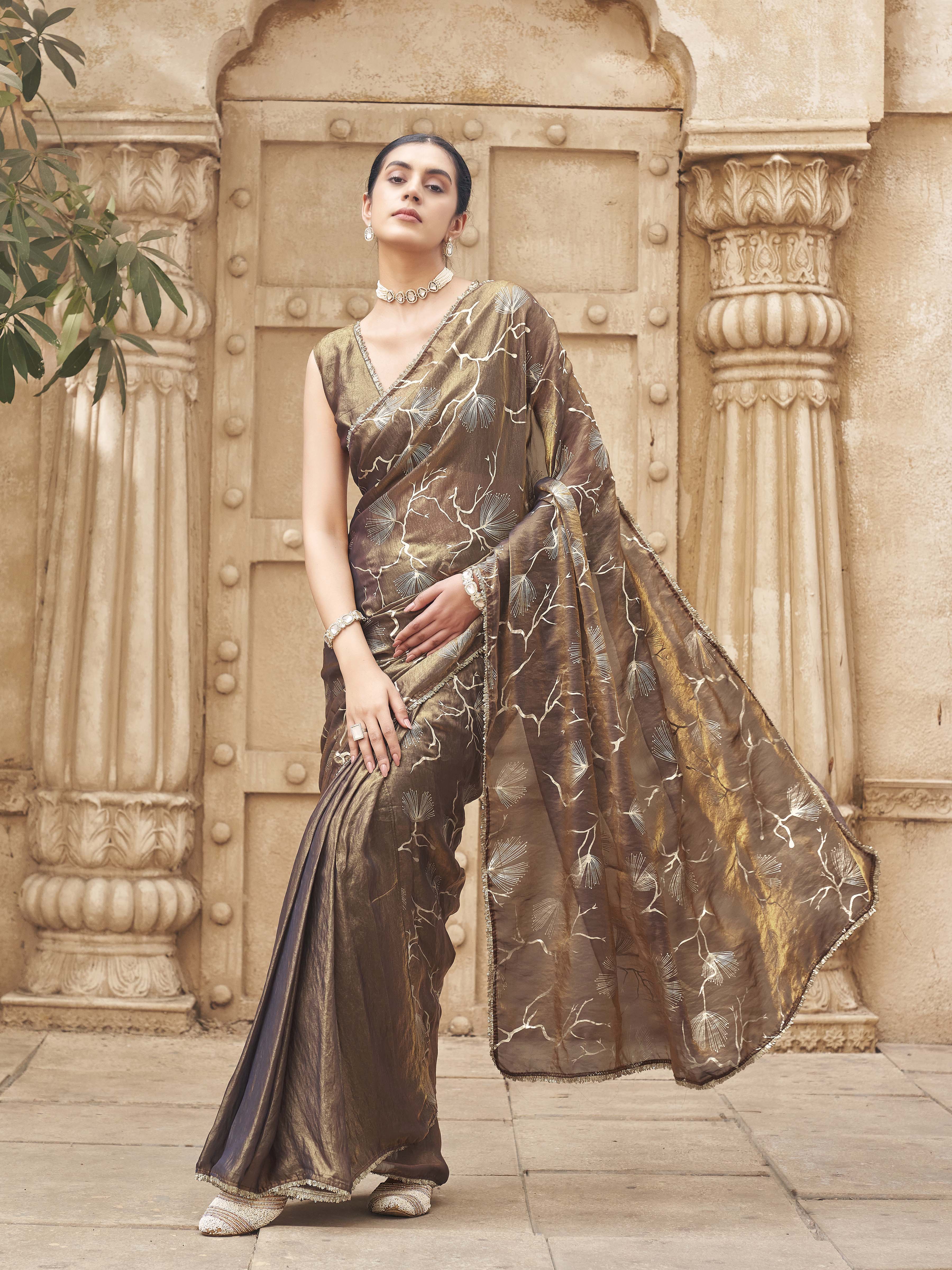 Ready to wear two toned gold and blue colored half and half foil embellished saree