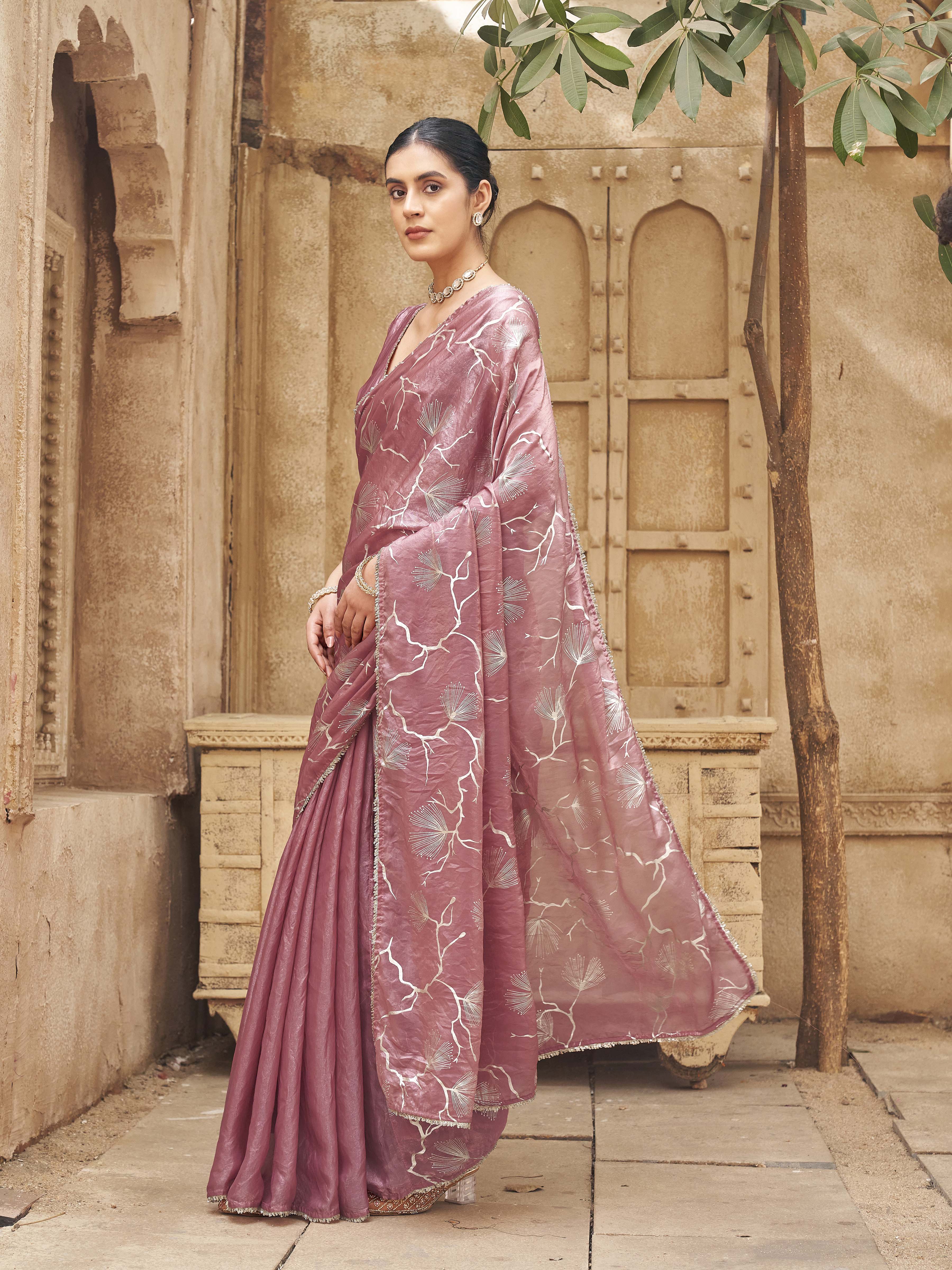 Ready to wear two toned pink and gold colored half and half foil embellished saree