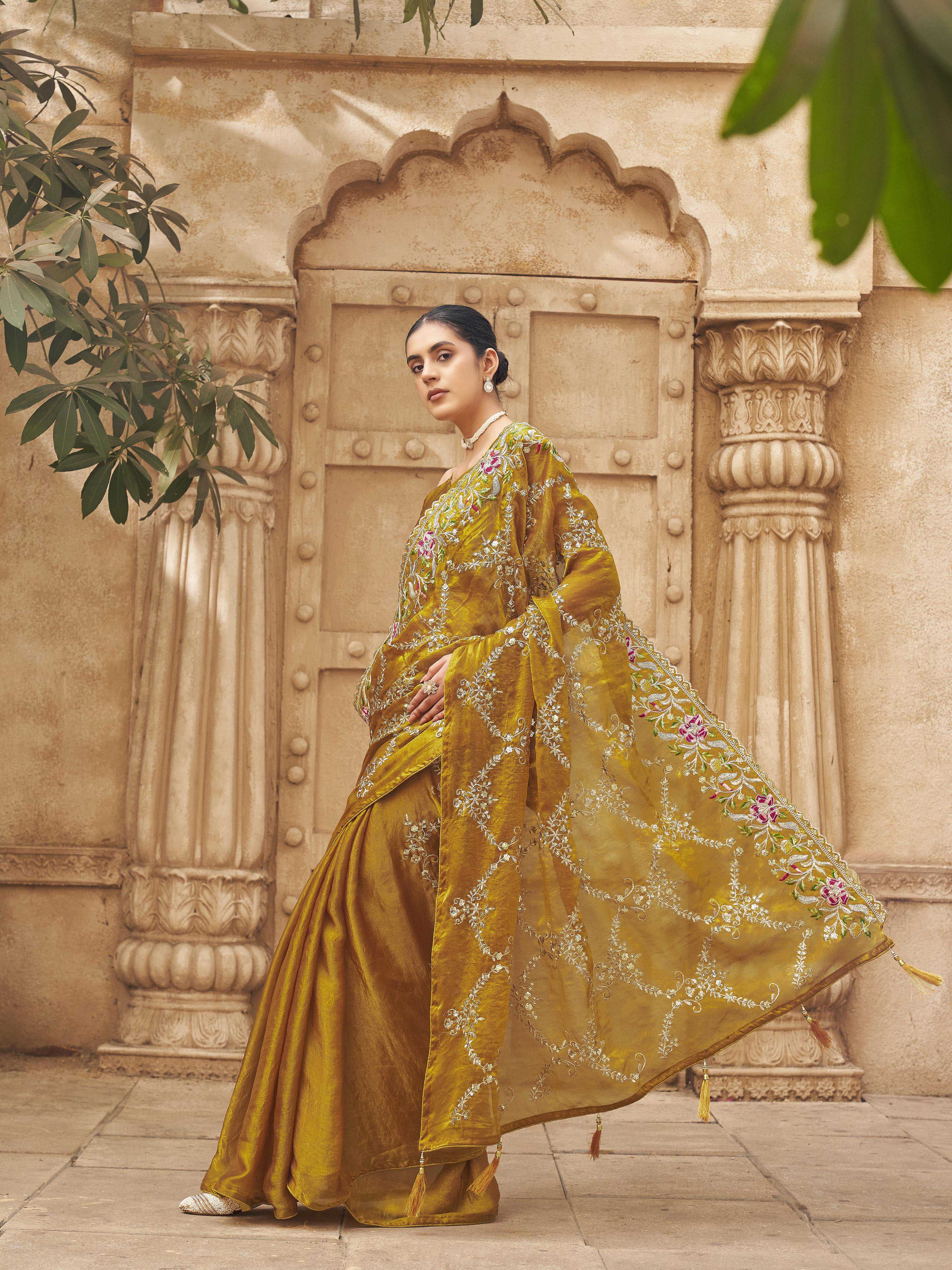 Two tone yellow and gold colored satin designer saree with sequin embroidery on pallu