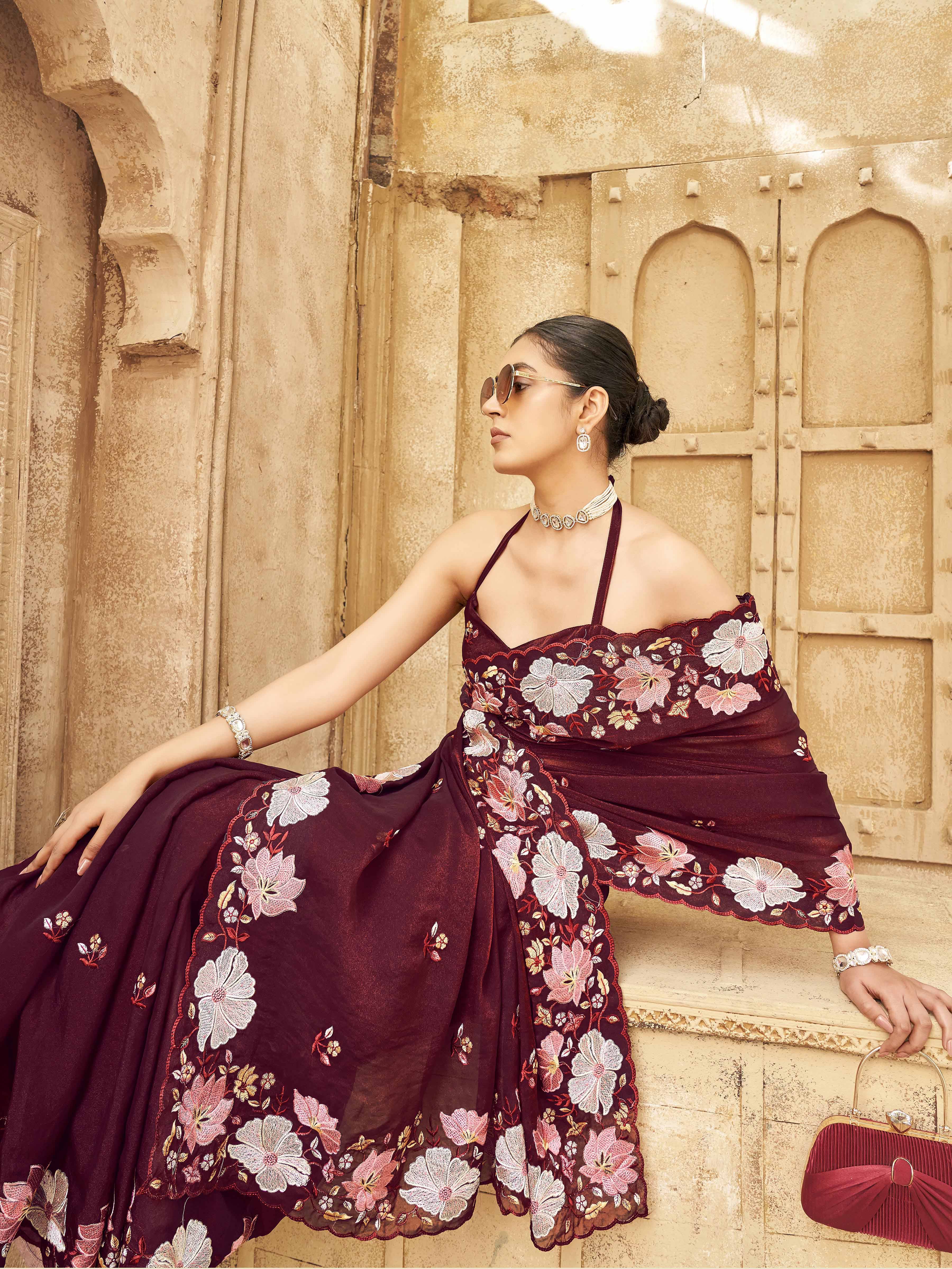 Maroon colored shimmer georgette base designer saree