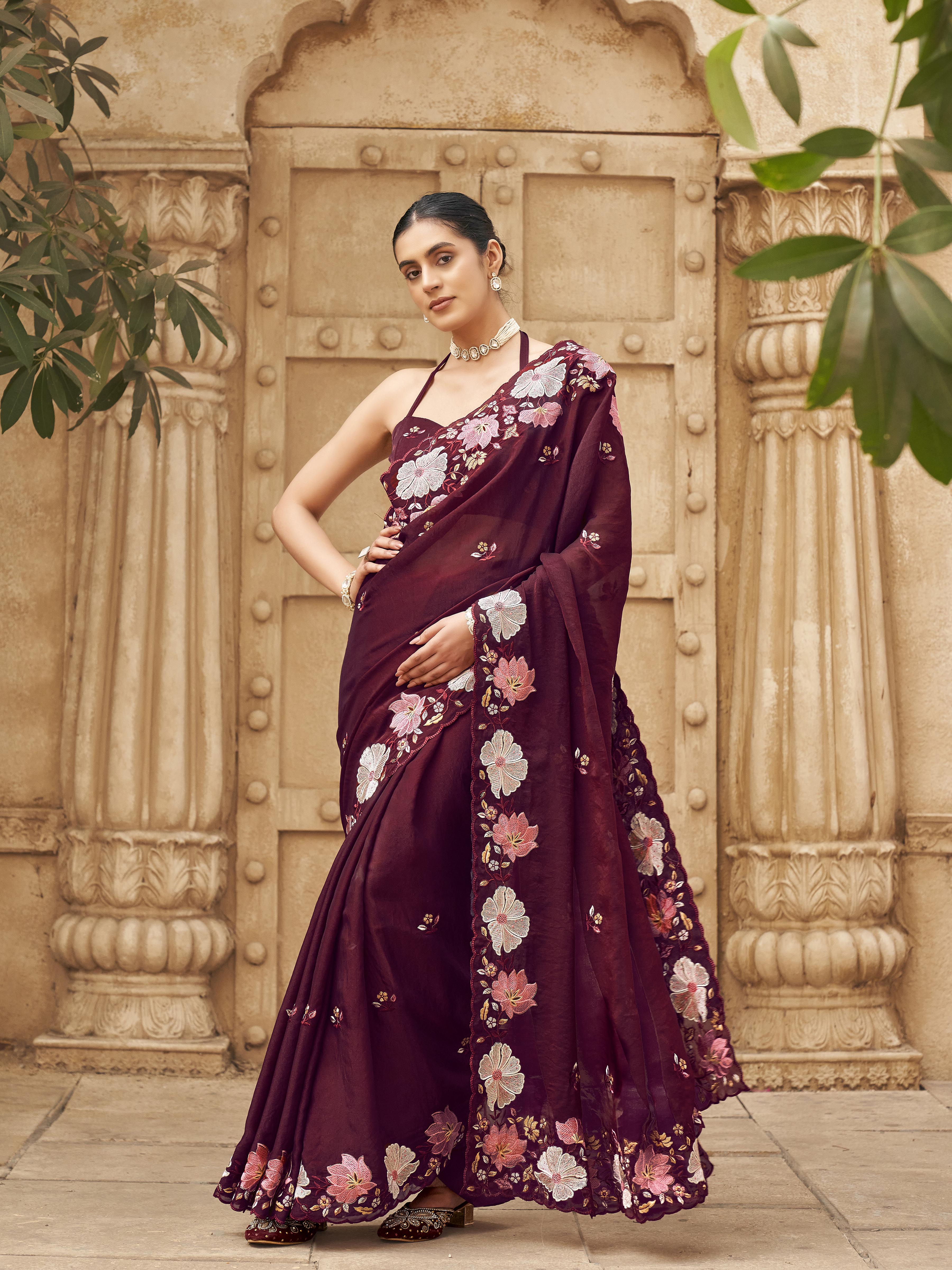 Maroon colored shimmer georgette base designer saree