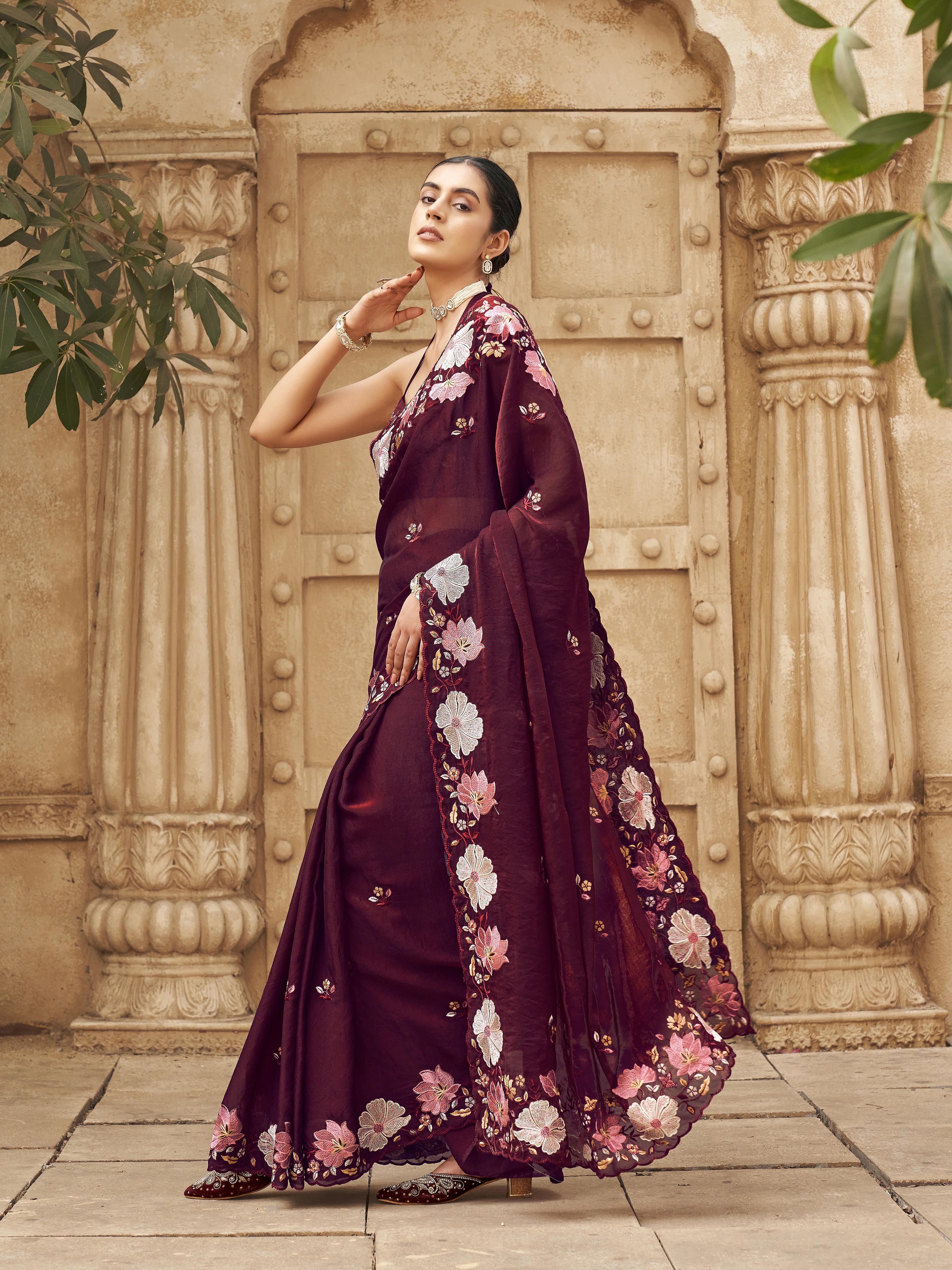 Maroon colored shimmer georgette base designer saree